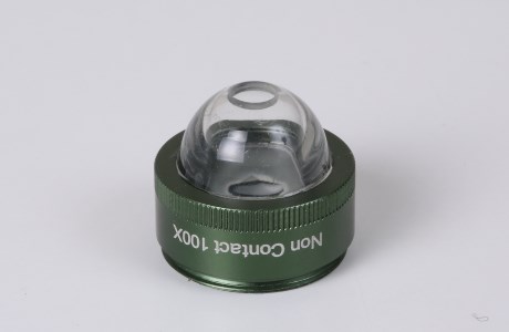 Immersion fluid non-contact adapter for 100x lens